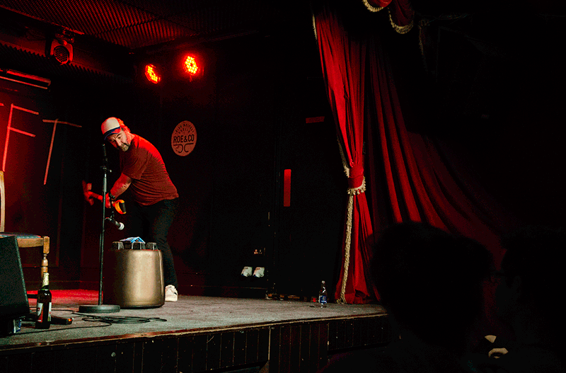 David O'Doherty hitting a packet of Tayto crisps with a shovel at the Workman's Club, Dublin by Sean Smyth